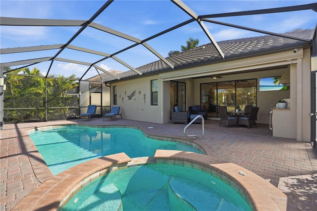 3022 Aviamar Circle Naples, FL 34114 - Photo 1 of 49 a front view of house with a garden and patio