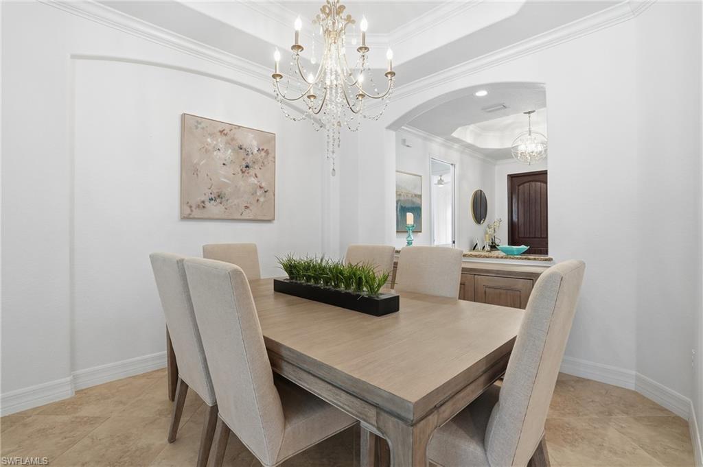 3022 Aviamar Circle Naples, FL 34114 - Photo 16 of 49 a view of a dining room with furniture and a chandelier