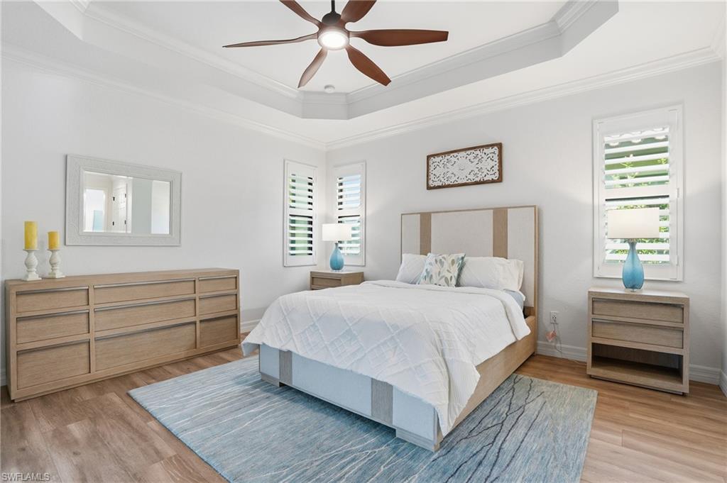 3022 Aviamar Circle Naples, FL 34114 - Photo 18 of 49 a bedroom with a bed and a window