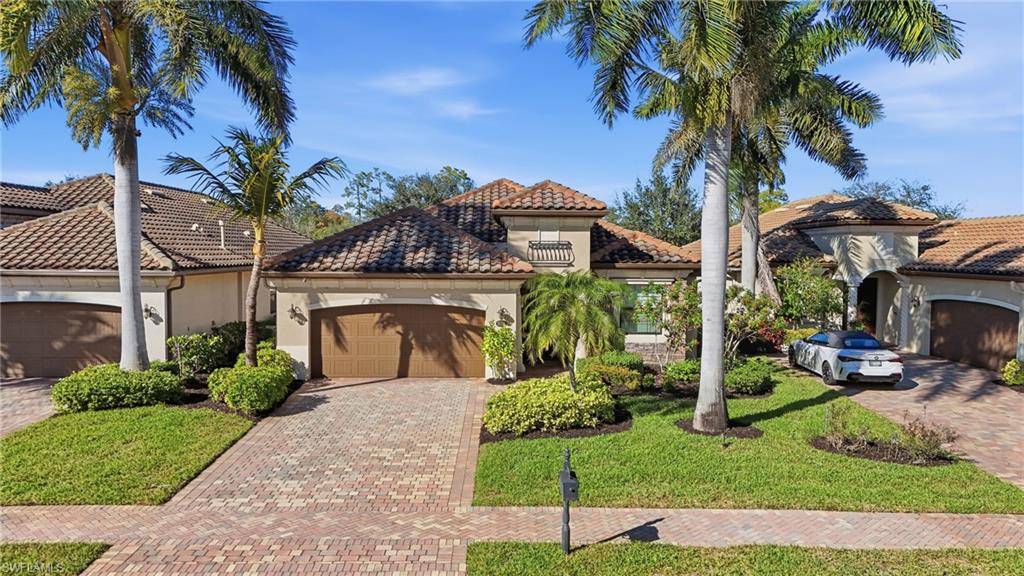 3022 Aviamar Circle Naples, FL 34114 - Photo 3 of 49 a front view of a house with garden