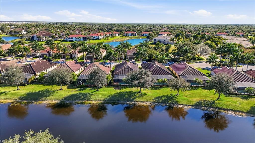 3022 Aviamar Circle Naples, FL 34114 - Photo 33 of 49 an aerial view of residential house with outdoor space and lake view