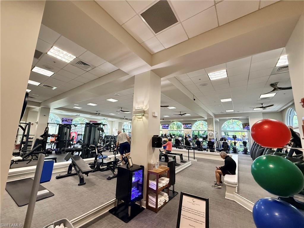3022 Aviamar Circle Naples, FL 34114 - Photo 48 of 49 a room with gym equipment and a view of living room