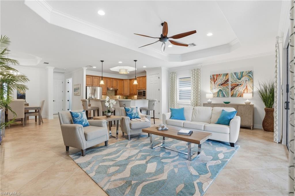 3022 Aviamar Circle Naples, FL 34114 - Photo 10 of 49 a living room with furniture and a large window
