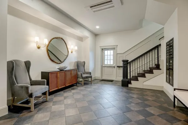 a living room with furniture wooden floor and a chandelier
