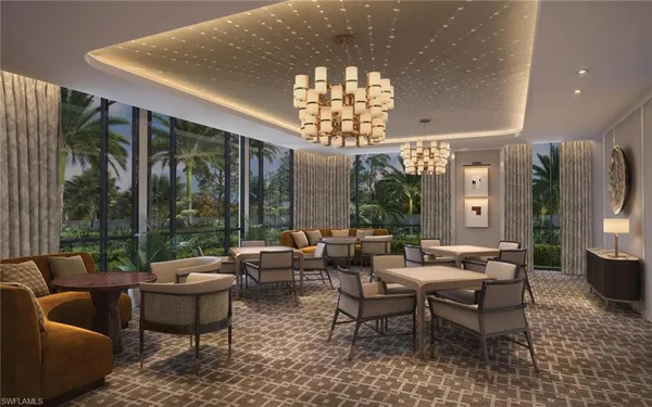 a living room with patio furniture and a chandelier