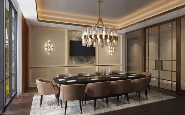 a view of a dining room with furniture and chandelier