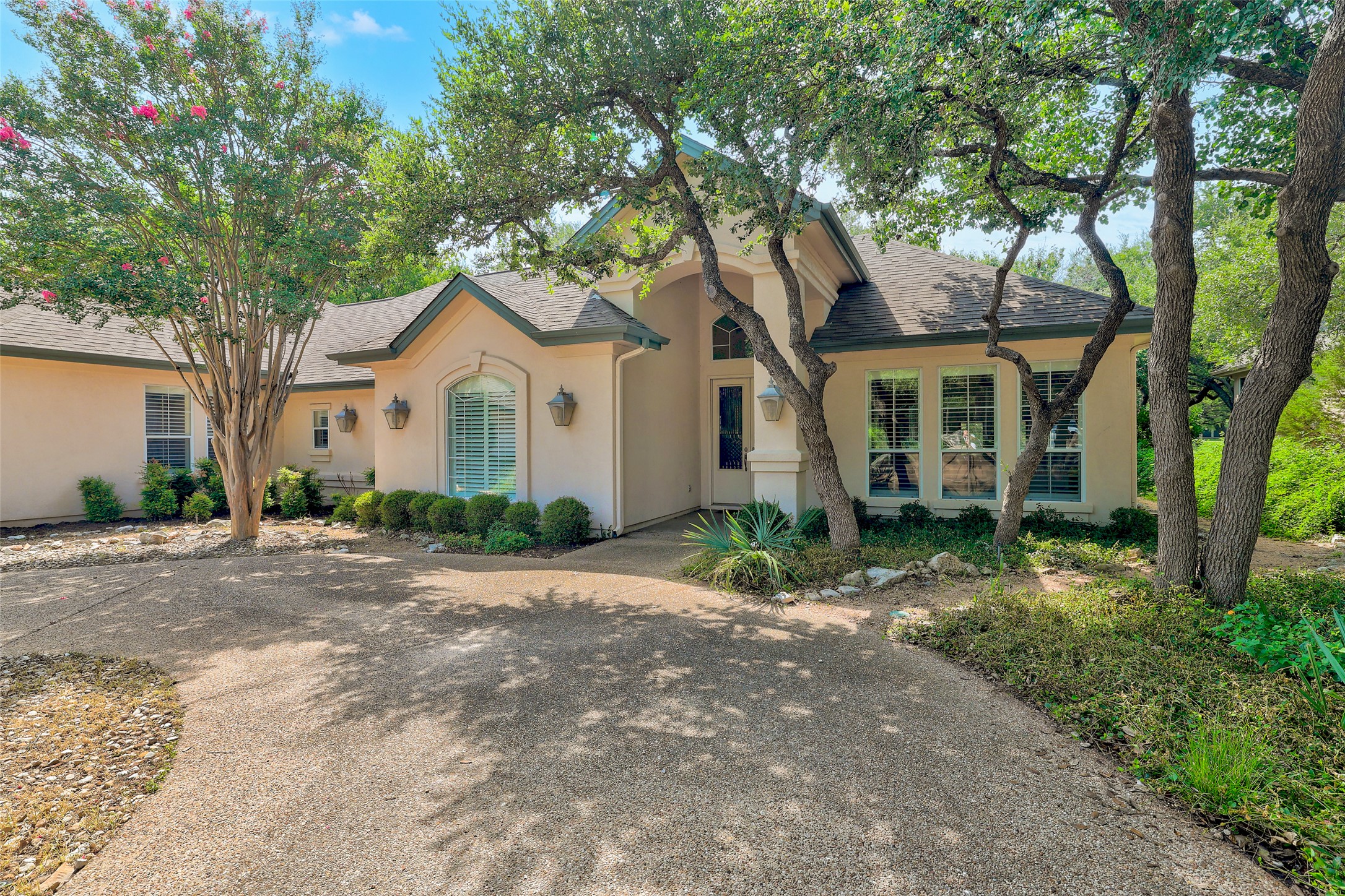 33 Meadows End Georgetown, TX 78628 - Photo 1 of 40 Mature trees frame this inviting residence, showcasing its well-maintained facade and picturesque curb appeal.