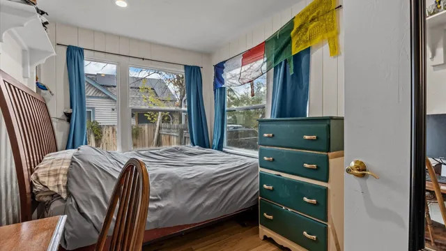 a bedroom with a bed and a window