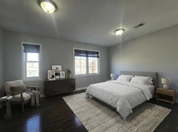 a bedroom with a bed and window