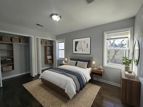 a bedroom with a large bed and a window