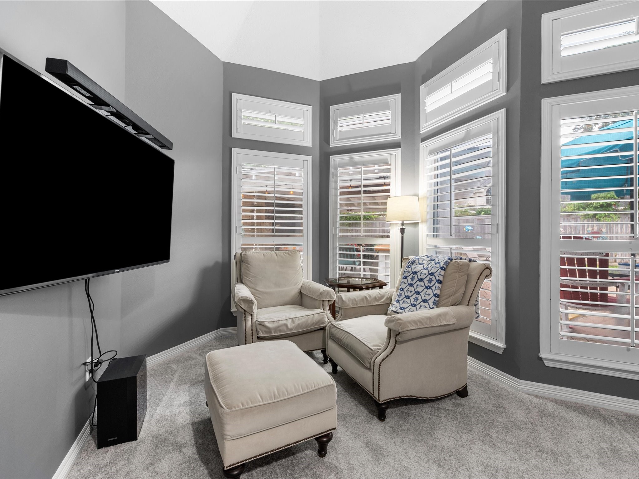 5910 Center Ct Drive Spring, TX 77379 - Photo 21 of 50 The primary sitting area is framed by expansive windows that create an open, airy connection to the outdoors, enhancing the suite’s sense of space and natural light. Enjoy peace of mind with recently updated carpets (May 2026).