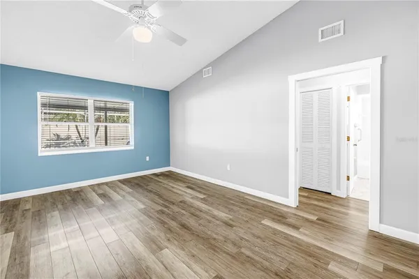 a view of a kitchen with wooden floor and a kitchen