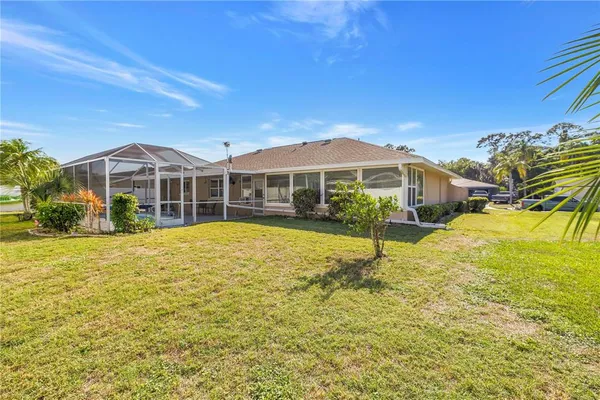 a front view of a house with a yard and outdoor