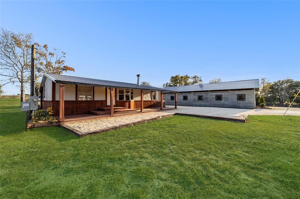 6491 Southeast 185 Terrace Morriston, FL 32668 - Photo 11 of 51 a view of a house with a backyard porch and sitting area