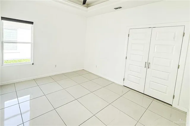 a bathroom with a granite countertop toilet and a shower