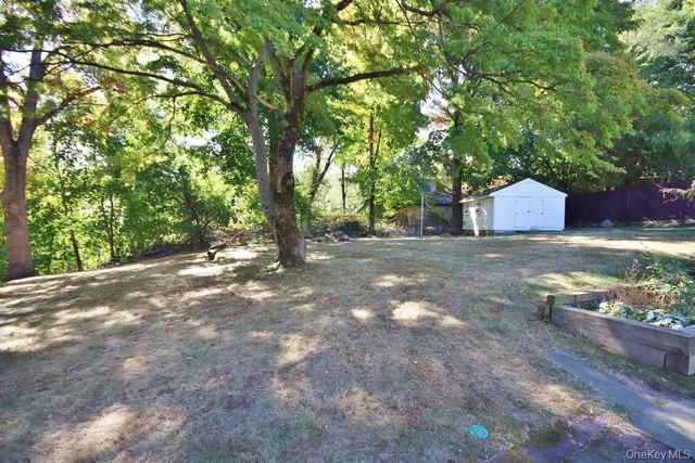 a view of backyard with green space