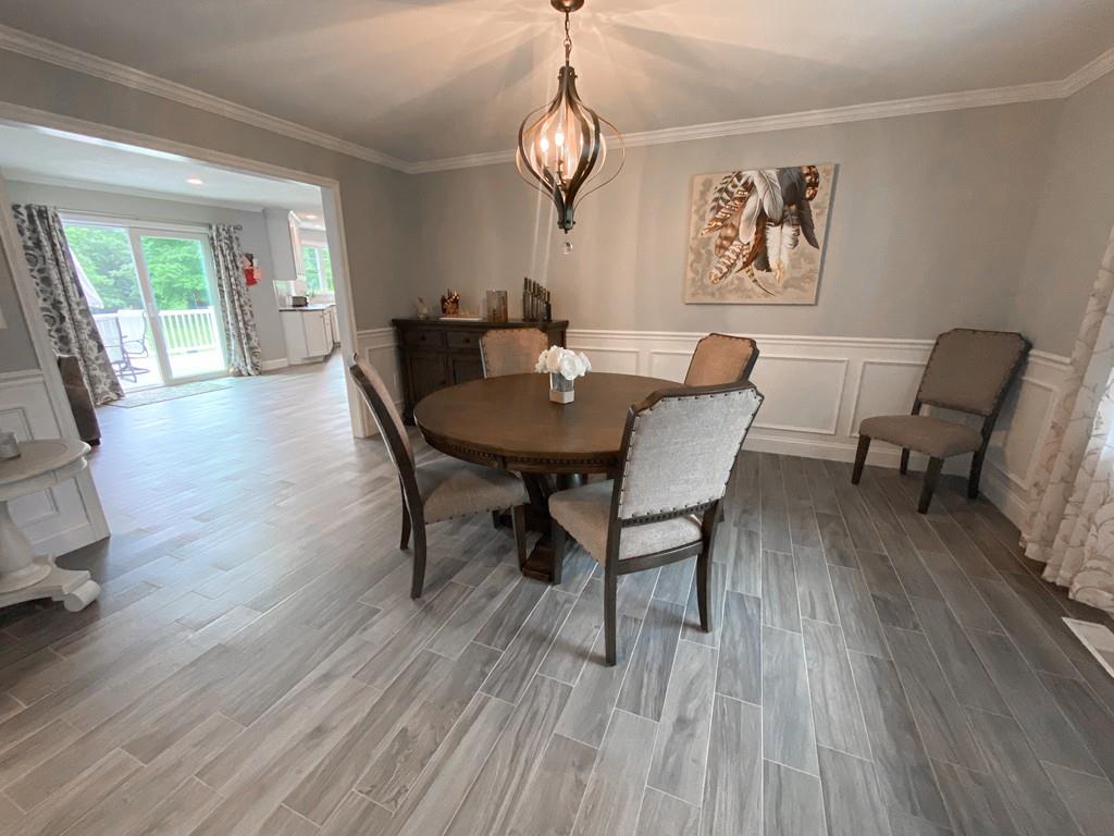 534 Boxford Road Haverhill, MA 01835 - Photo 8 of 42 a view of a dining room with furniture window and wooden floor