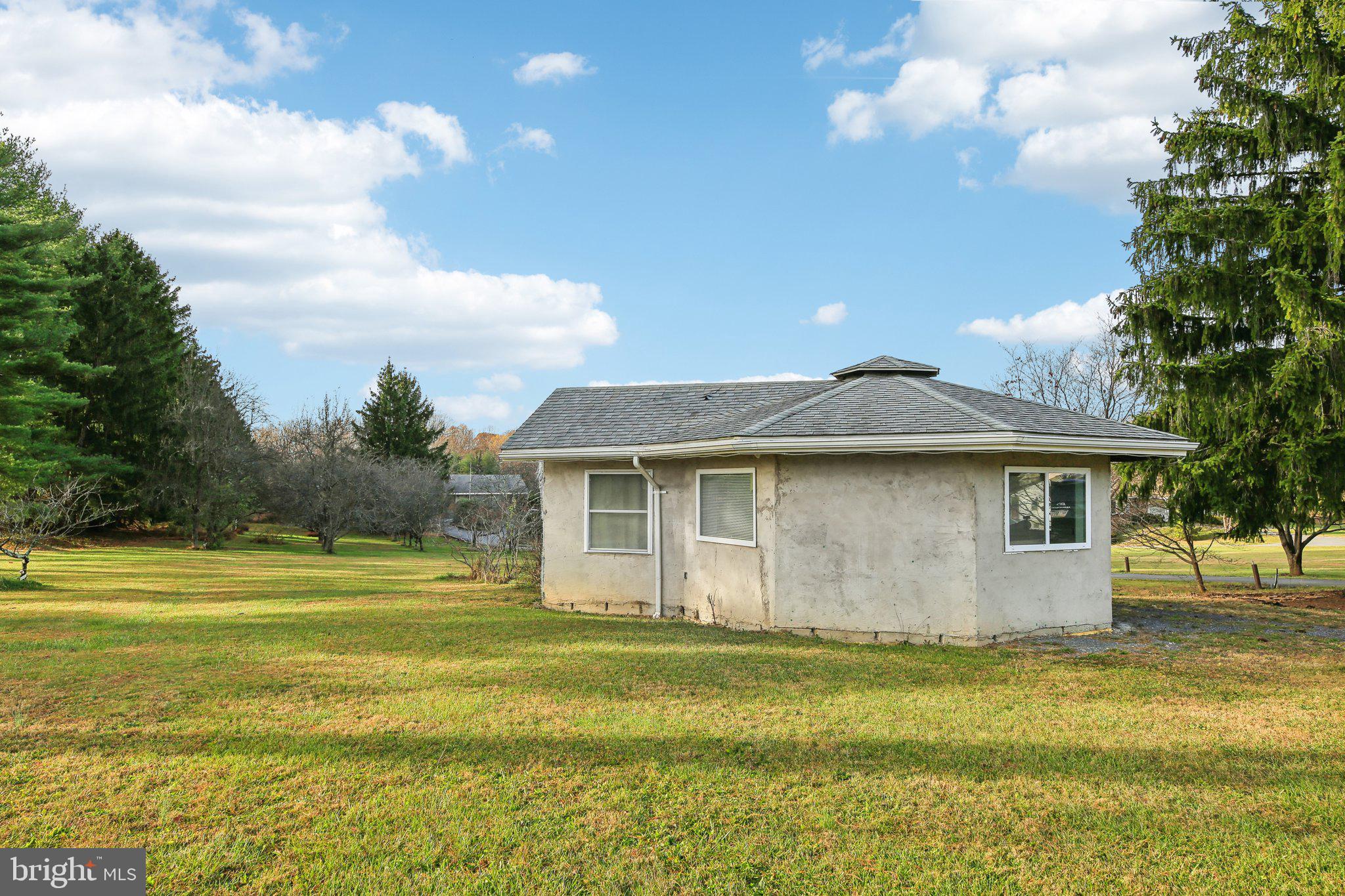 1170 Ridge Road Mount Airy, MD 21771 - Photo 15 of 16 a front view of a house with a garden