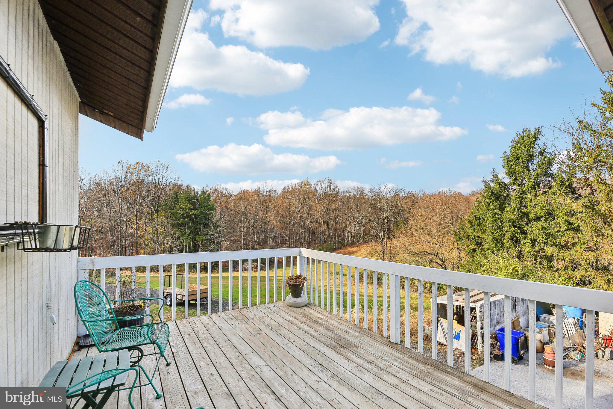 1170 Ridge Road Mount Airy, MD 21771 - Photo 4 of 16 a view of a balcony with wooden floor and fence