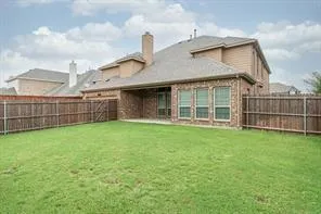 a view of a house with wooden floor and fence
