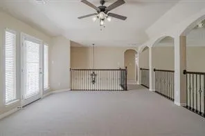 a view of a hallway with a window