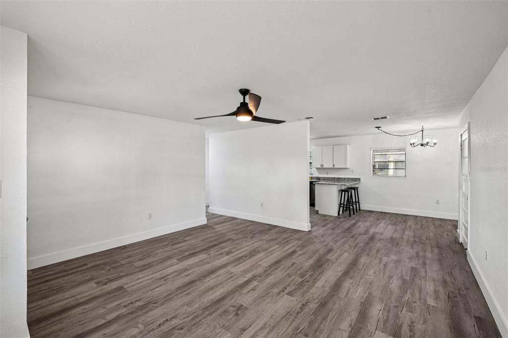 56305 Redbud Road Astor, FL 32102 - Photo 11 of 32 a view of empty room with wooden floor