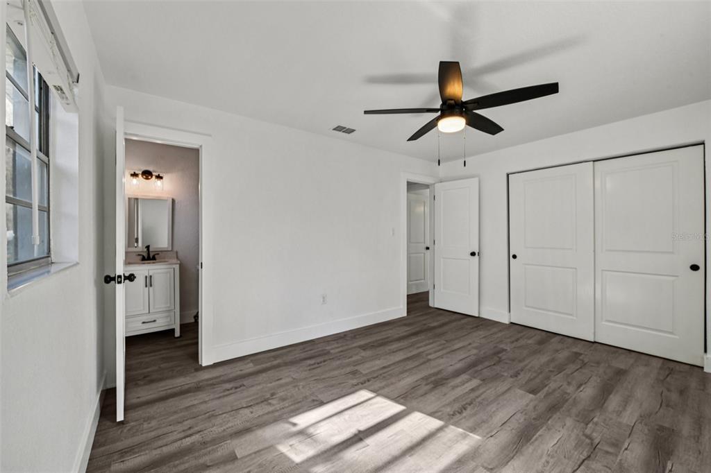 56305 Redbud Road Astor, FL 32102 - Photo 26 of 32 a view of empty room with wooden floor