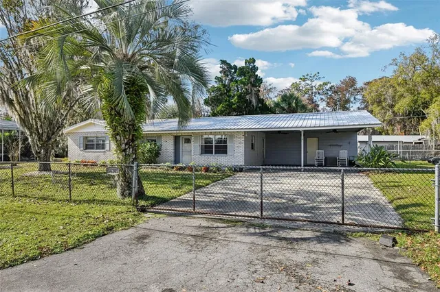 a front view of a house with a yard and porch