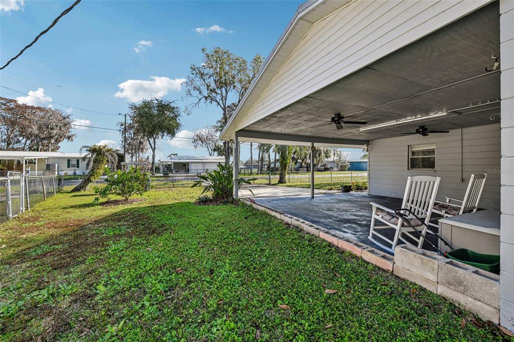 56305 Redbud Road Astor, FL 32102 - Photo 6 of 32 a view of a backyard with a patio