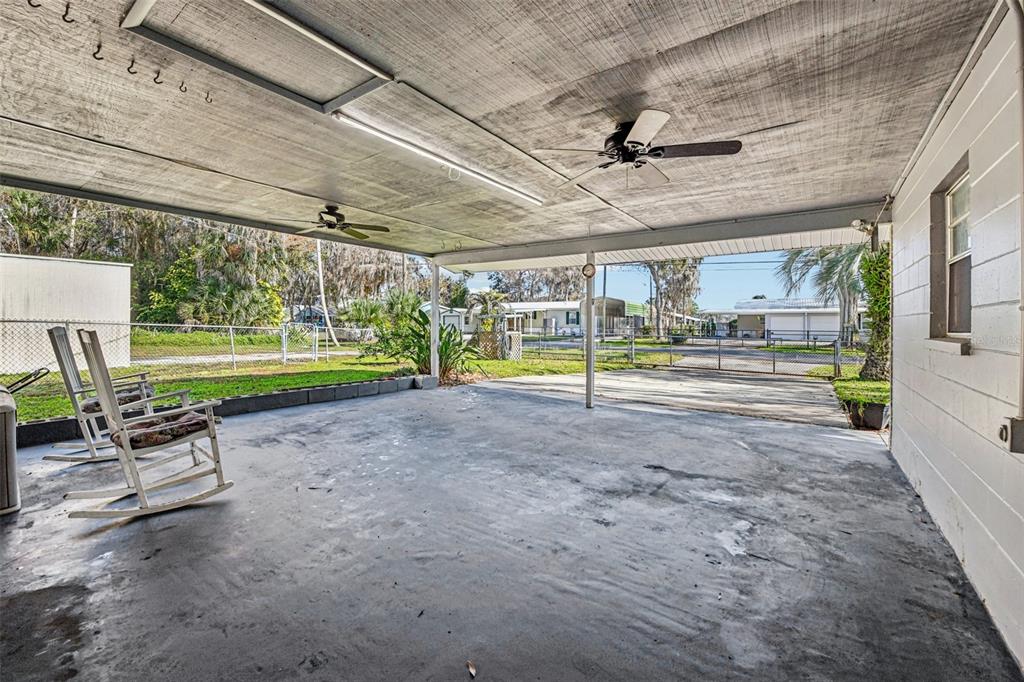 56305 Redbud Road Astor, FL 32102 - Photo 7 of 32 a view of a swimming pool with a patio