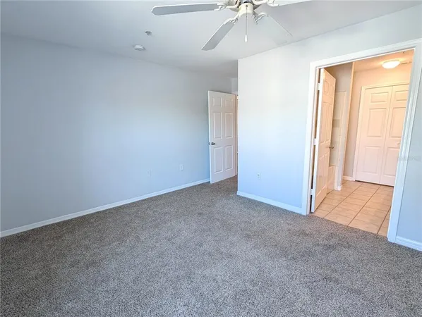 a bathroom with a granite countertop sink a mirror and a shower