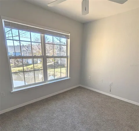 a spacious bathroom with a granite countertop tub sink shower and mirror
