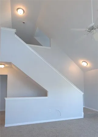an empty room with a empty space and windows