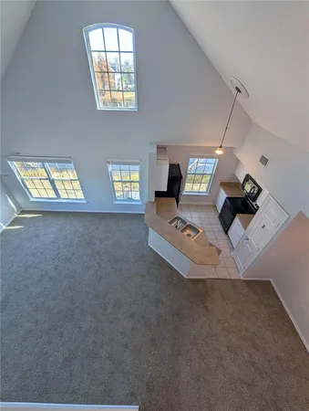 a view of a town with large trees and a small yard