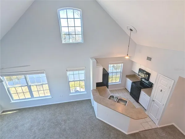 a kitchen with a refrigerator and a sink