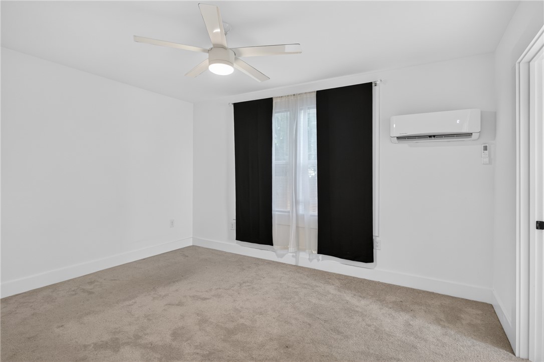 115 Pelfrey Street Seneca, SC 29672 - Photo 24 of 46 A well-lit bedroom offering plush carpeting and a modern ceiling fan for ultimate comfort.