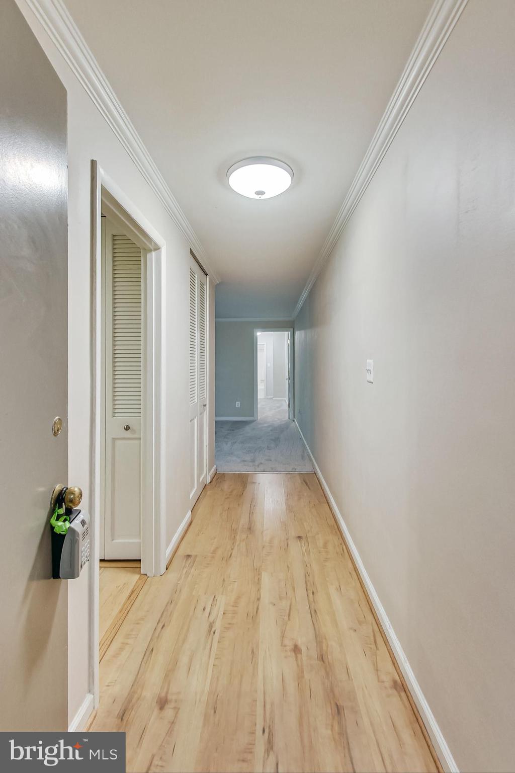 10501 Montrose Avenue, Unit 103 Bethesda, MD 20814 - Photo 11 of 27 a view of a room with wooden floor and entryway