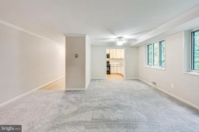 a view of an empty room with a window