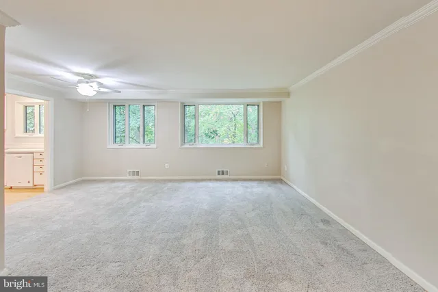 an empty room with windows