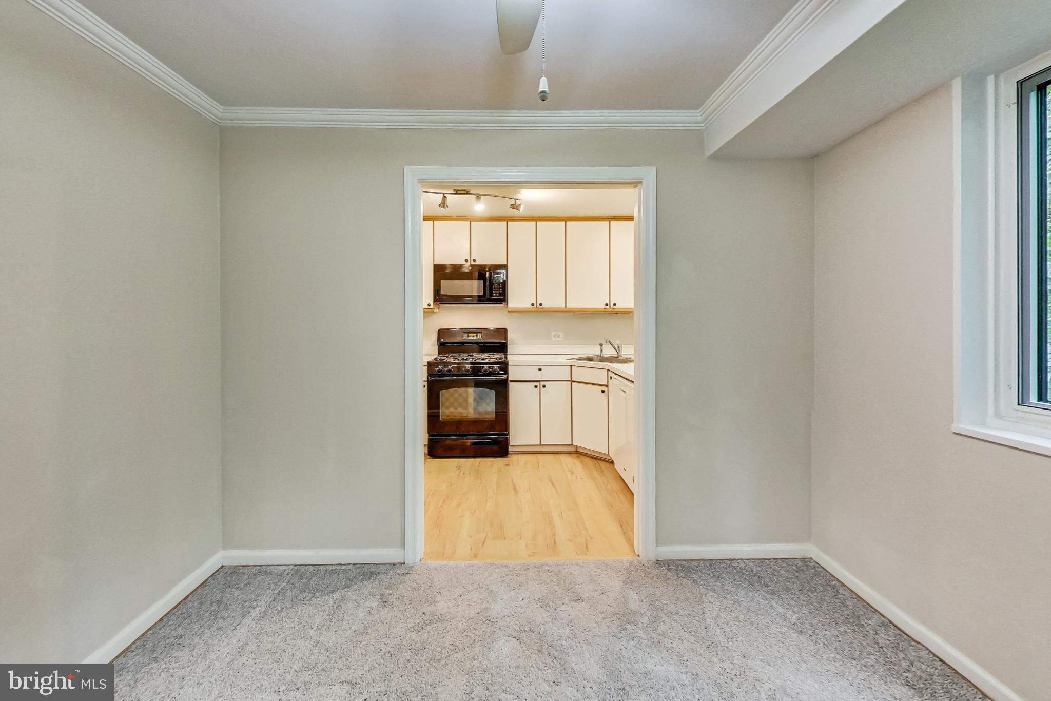 10501 Montrose Avenue, Unit 103 Bethesda, MD 20814 - Photo 17 of 27 a view of kitchen and wooden floor