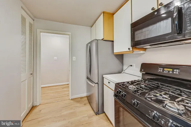a kitchen with a stove and a microwave