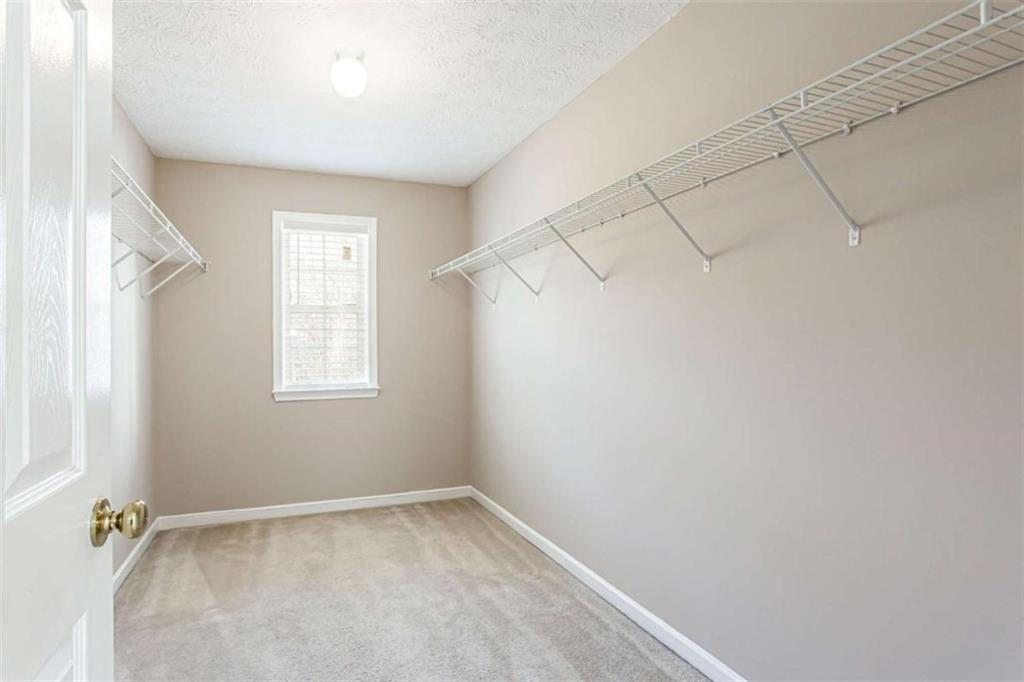 3721 Bogan Mill Road Northeast Buford, GA 30519 - Photo 25 of 58 an empty room with a window