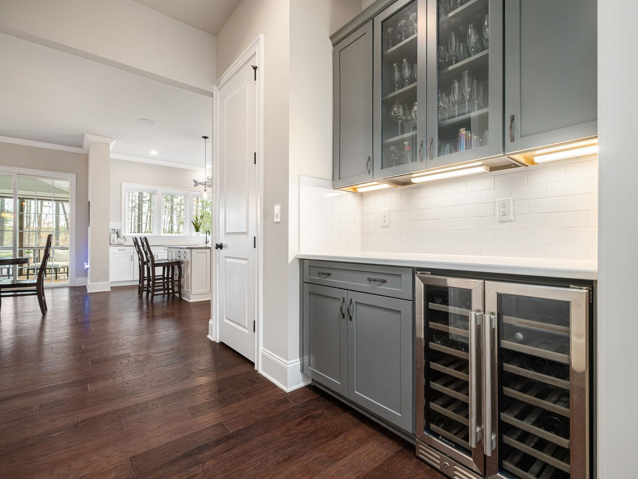 7532 Hasentree Way Wake Forest, NC 27587 - Photo 13 of 40 a kitchen with wooden floors and a sink