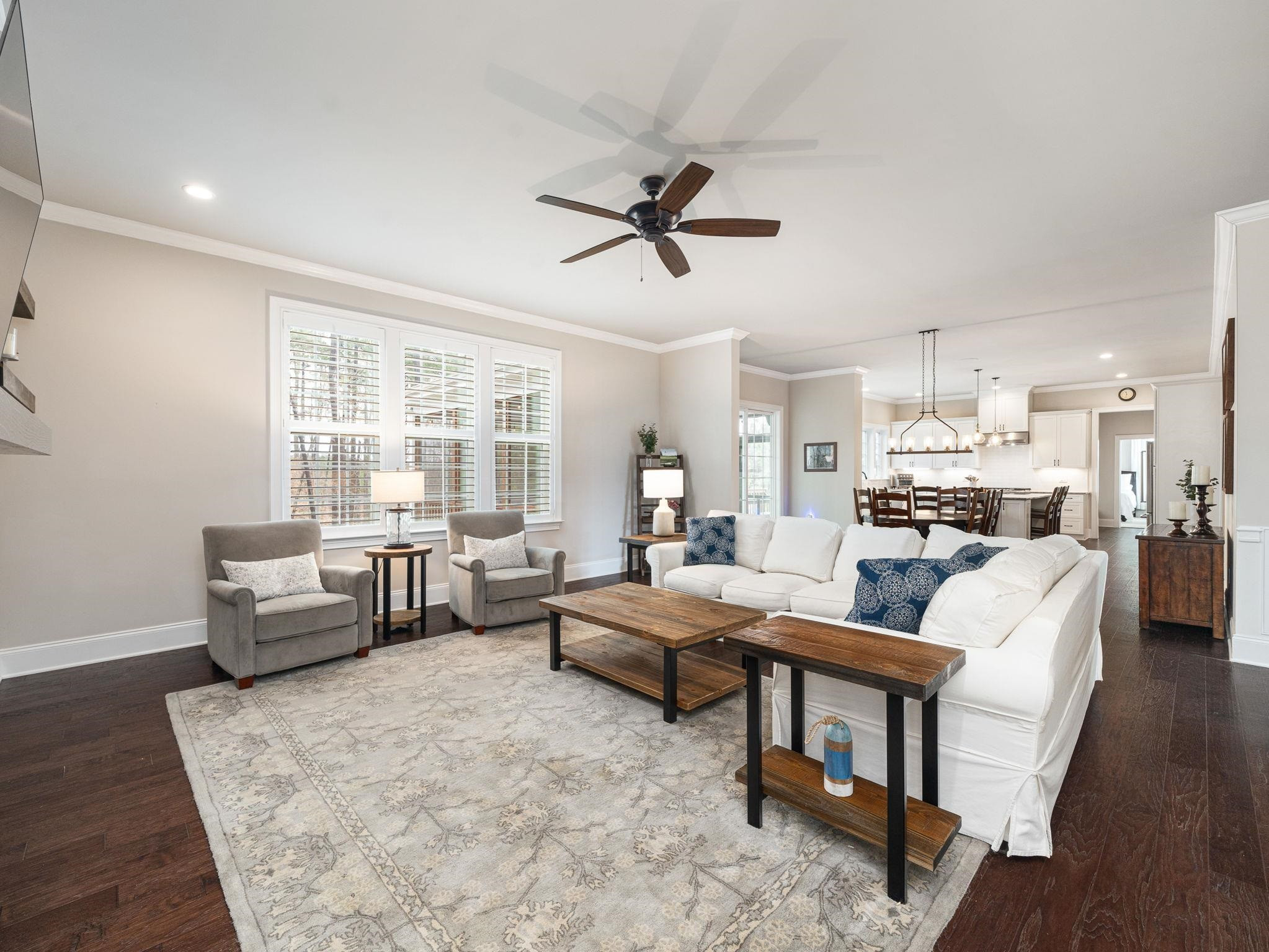 7532 Hasentree Way Wake Forest, NC 27587 - Photo 16 of 40 a living room with furniture and a large window