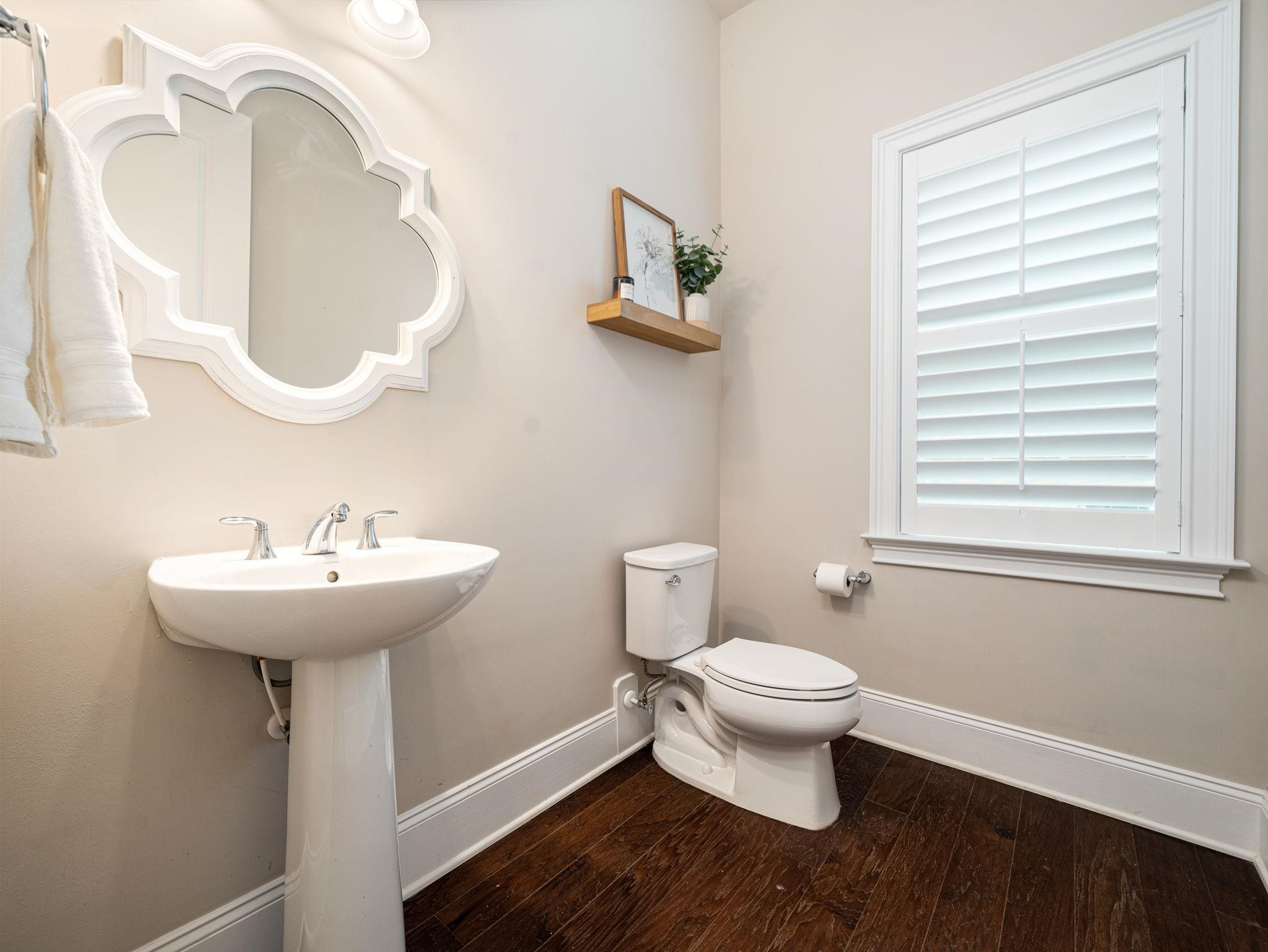 7532 Hasentree Way Wake Forest, NC 27587 - Photo 21 of 40 a bathroom with a toilet sink and mirror