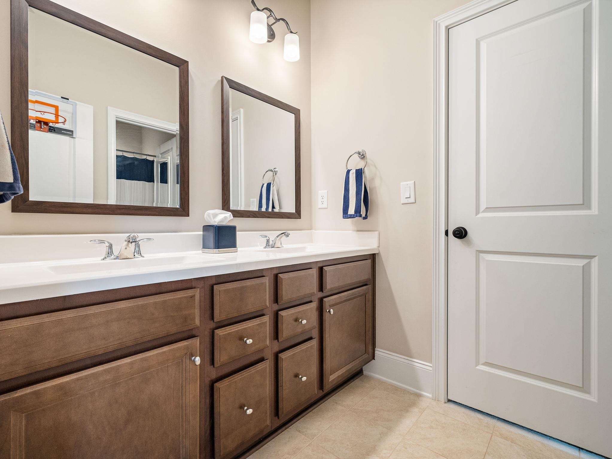 7532 Hasentree Way Wake Forest, NC 27587 - Photo 29 of 40 a bathroom with double sink and a mirror
