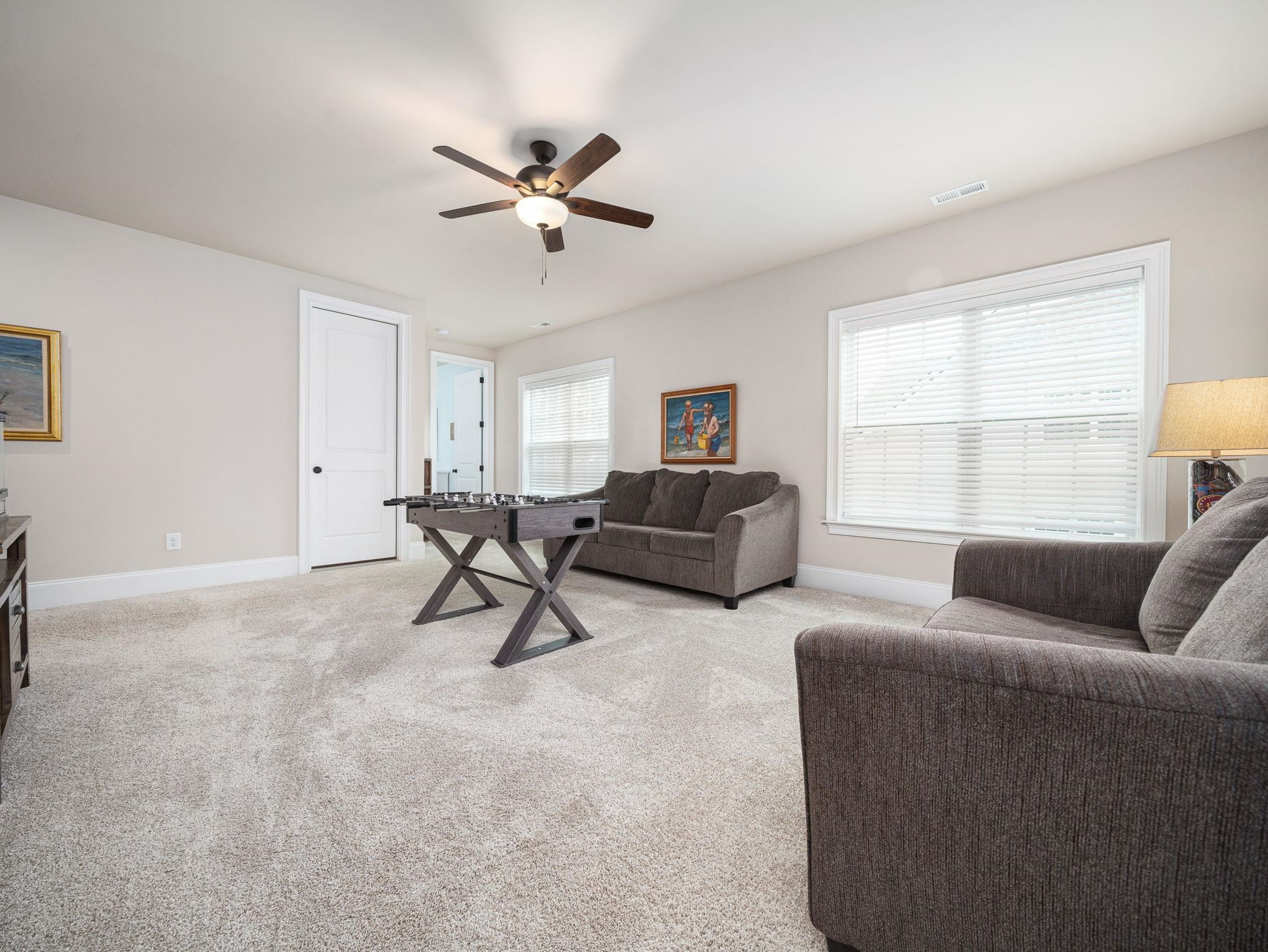 7532 Hasentree Way Wake Forest, NC 27587 - Photo 30 of 40 a living room with furniture and a window