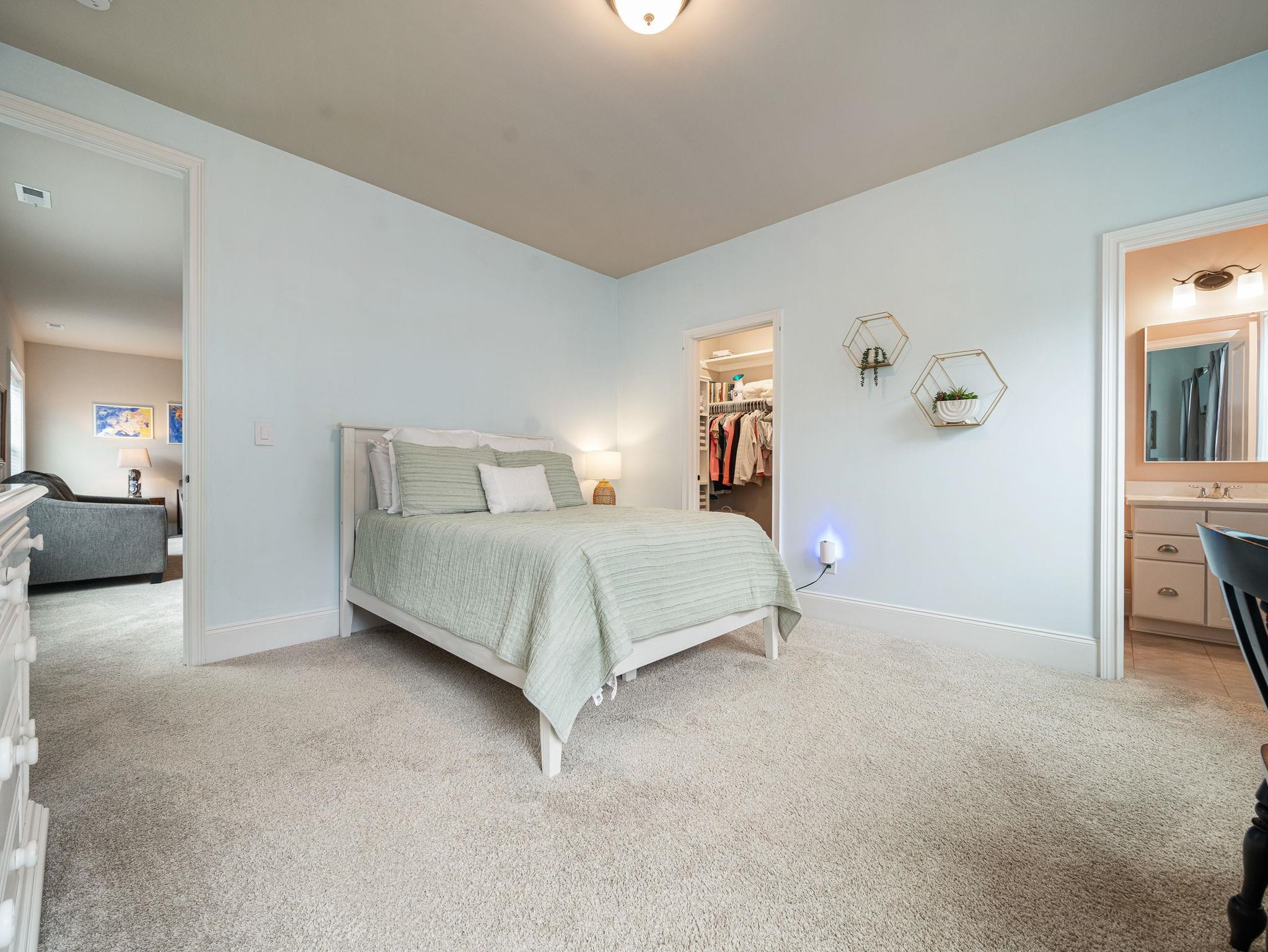 7532 Hasentree Way Wake Forest, NC 27587 - Photo 33 of 40 a bedroom with a bed and cabinets