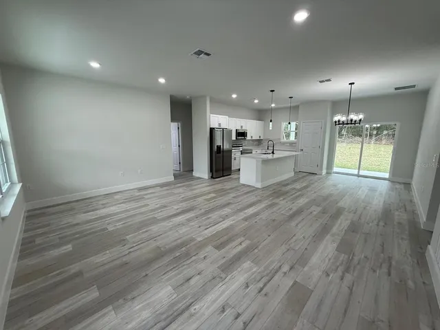 a view of kitchen and windows