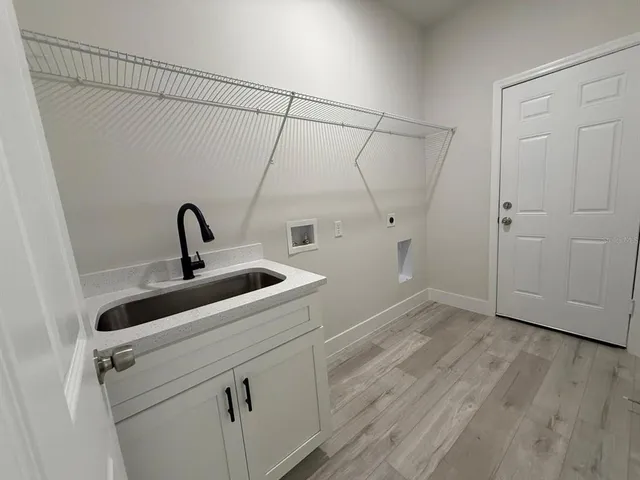 a view of a storage & utility room with wooden floor